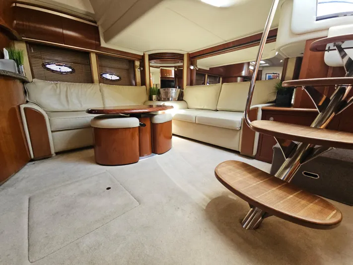 Nautical Dreamer Yacht Photos Pics Luxurious interior of 2005 Sea Ray 500 Sundancer yacht with elegant seating and wooden accents.