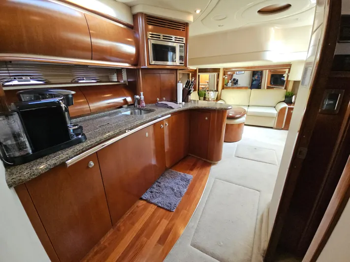 Nautical Dreamer Yacht Photos Pics Luxurious interior of 2005 Sea Ray 500 Sundancer yacht with modern kitchen amenities.