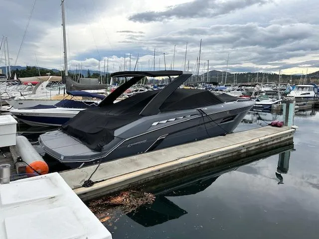  Yacht Photos Pics 2017 Cruisers Yachts 338 SOUTH BEACH docked at a marina under cloudy skies.