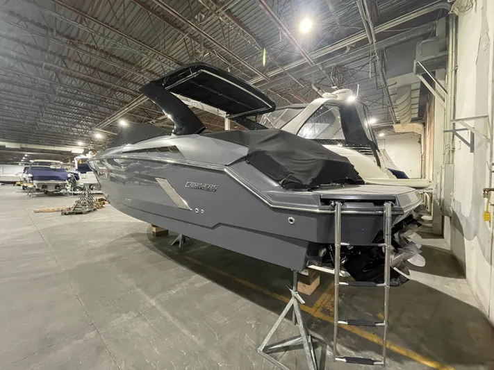  Yacht Photos Pics 2017 Cruisers Yachts 338 SOUTH BEACH in storage, showcasing sleek design and modern features.