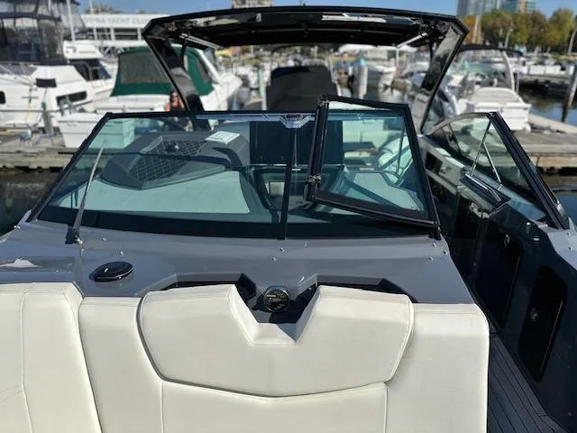  Yacht Photos Pics 2017 Cruisers Yachts 338 SOUTH BEACH boat interior with open windshield at marina.