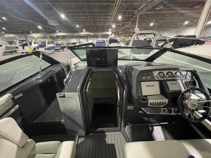  Yacht Photos Pics 2017 Cruisers Yachts 338 SOUTH BEACH interior with modern dashboard and seating in a showroom.