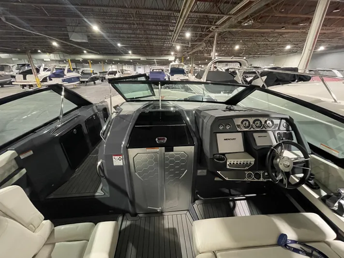  Yacht Photos Pics 2017 Cruisers Yachts 338 South Beach interior with modern dashboard and seating in a showroom.