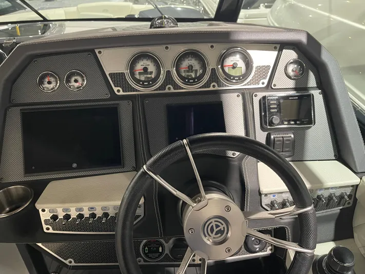  Yacht Photos Pics Cockpit of 2017 Cruisers Yachts 338 SOUTH BEACH with gauges and steering wheel.