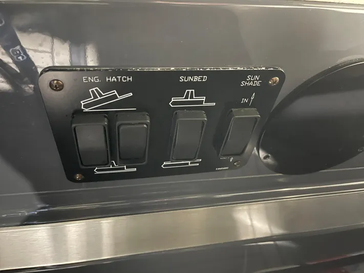  Yacht Photos Pics Control panel of 2017 Cruisers Yachts 338 SOUTH BEACH with switches for engine hatch, sunbed, sun shade.