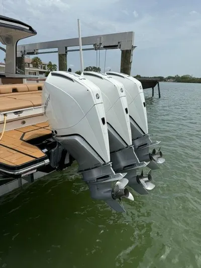  Yacht Photos Pics 2023 Aviara AV36 OB boat with triple outboard engines on water.