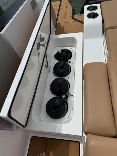  Yacht Photos Pics 2023 Aviara AV36 OB boat with built-in cup holders and seating area.