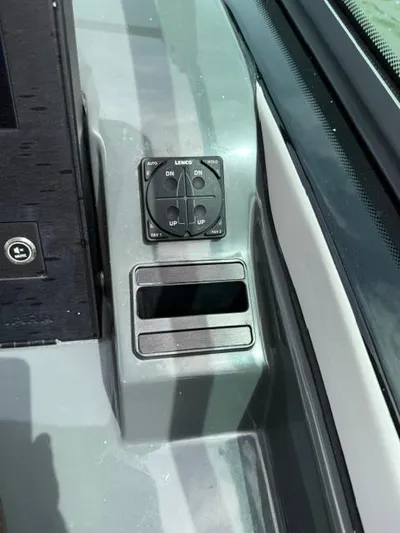  Yacht Photos Pics Control panel on 2023 Aviara AV36 OB boat dashboard, featuring trim tab switches.