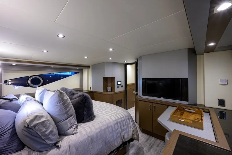 No Name 66 Marquis Yacht Photos Pics Luxurious interior of 2017 Marquis 660 Sport Yacht bedroom with modern decor and cozy bedding.