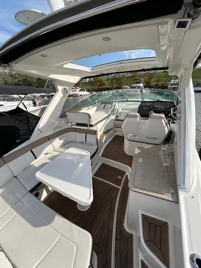  Yacht Photos Pics 2016 Sea Ray 350 Sundancer interior with seating, table, and helm, docked in marina.