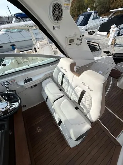  Yacht Photos Pics 2016 Sea Ray 350 Sundancer interior with white seating and wood flooring.