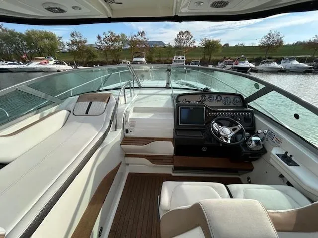  Yacht Photos Pics 2016 Sea Ray 350 Sundancer cockpit with modern controls and spacious seating.
