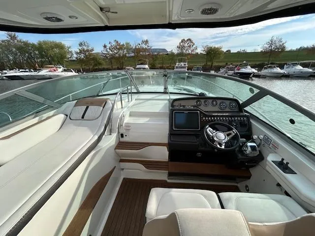  Yacht Photos Pics 2016 Sea Ray 350 Sundancer cockpit with modern controls and spacious seating.