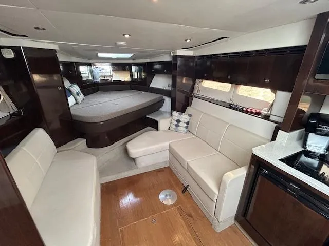  Yacht Photos Pics Luxurious interior of 2016 Sea Ray 350 Sundancer yacht with modern furnishings.