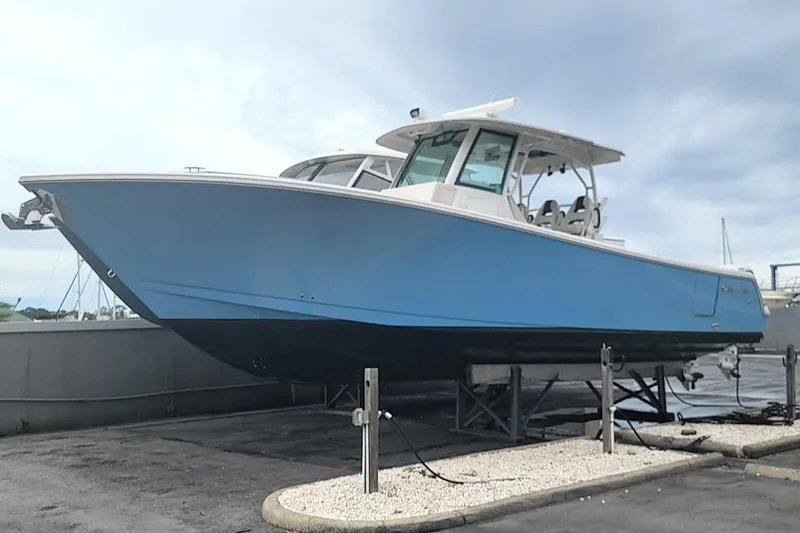  Yacht Photos Pics 2022 Sailfish 360 CC boat in dry dock, featuring a sleek blue hull design.