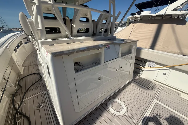  Yacht Photos Pics 2022 Sailfish 360 CC boat deck with seating and storage compartments.