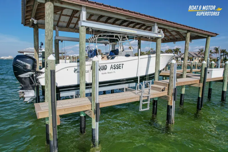  Yacht Photos Pics 2018 Key West Billistic 351 Center Console boat docked on lift in marina.