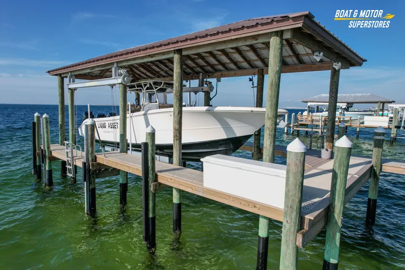  Yacht Photos Pics 2018 Key West Billistic 351 Center Console on dock lift, ocean backdrop.