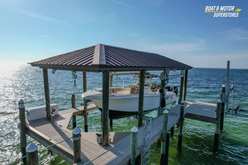  Yacht Photos Pics 2018 Key West Billistic 351 Center Console on docked lift over ocean.