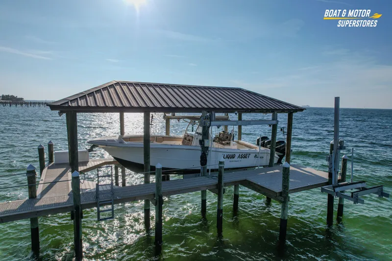  Yacht Photos Pics 2018 Key West Billistic 351 Center Console on docked lift over water.