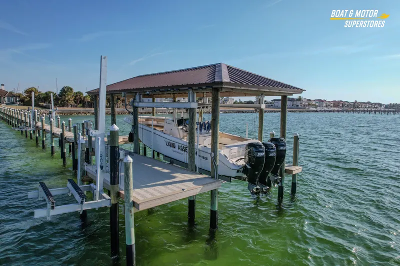  Yacht Photos Pics 2018 Key West Billistic 351 Center Console boat docked on a lift in a marina.