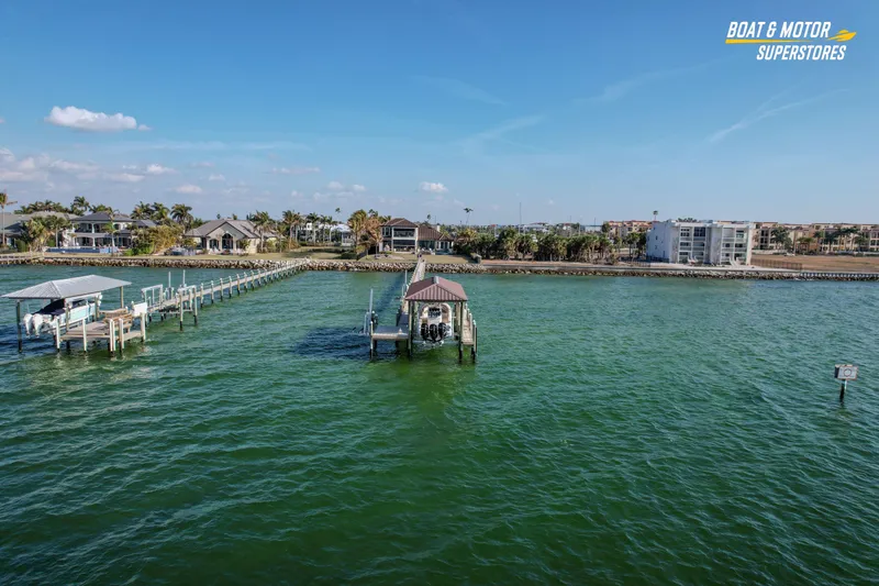  Yacht Photos Pics Scenic waterfront view with docks and a 2018 Key West Billistic 351 Center Console boat.