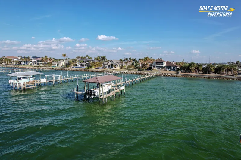  Yacht Photos Pics Aerial view of 2018 Key West Billistic 351 Center Console docked by waterfront homes.