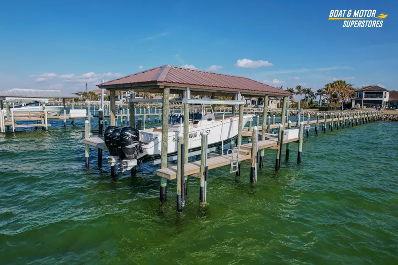  Yacht Photos Pics 2018 Key West Billistic 351 Center Console on dock, green water, clear sky.
