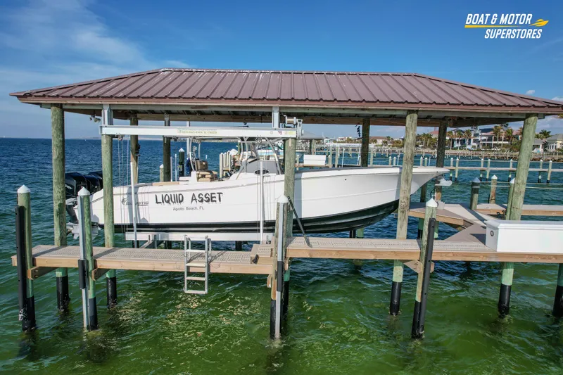  Yacht Photos Pics 2018 Key West Billistic 351 Center Console boat docked at marina, labeled "Liquid Asset."