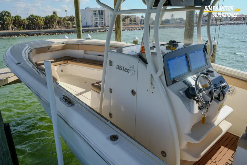  Yacht Photos Pics 2018 Key West Billistic 351 Center Console boat docked, featuring modern navigation equipment.