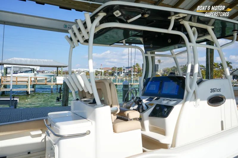  Yacht Photos Pics 2018 Key West Billistic 351 Center Console boat docked at marina, featuring modern controls.