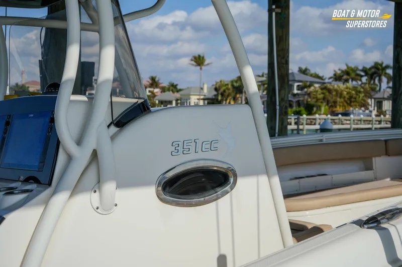  Yacht Photos Pics 2018 Key West Billistic 351 Center Console boat, docked with clear skies and palm trees.