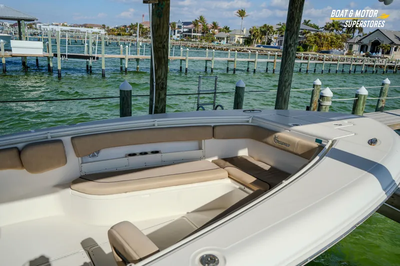  Yacht Photos Pics 2018 Key West Billistic 351 Center Console boat docked by waterfront homes.