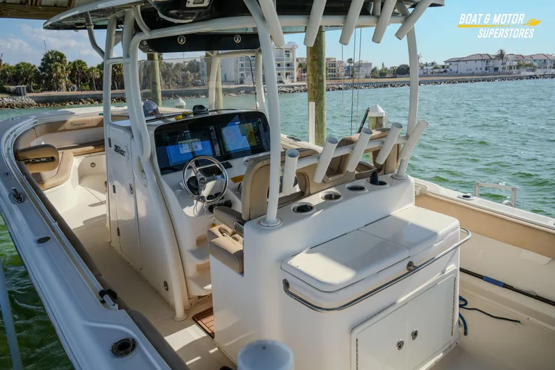  Yacht Photos Pics 2018 Key West Billistic 351 Center Console boat interior with helm and seating, docked by the water.