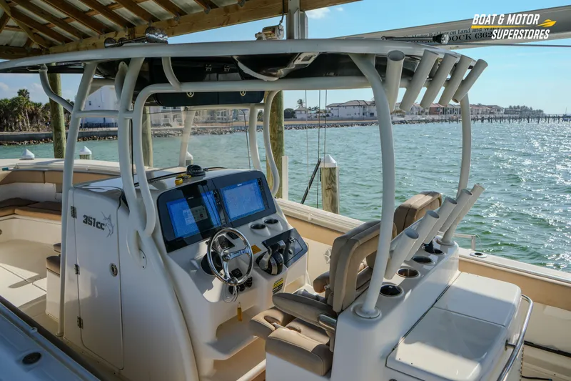  Yacht Photos Pics 2018 Key West Billistic 351 Center Console boat with dual screens, docked by the water.