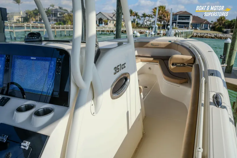 Yacht Photos Pics 2018 Key West Billistic 351 Center Console boat docked, featuring modern navigation equipment.