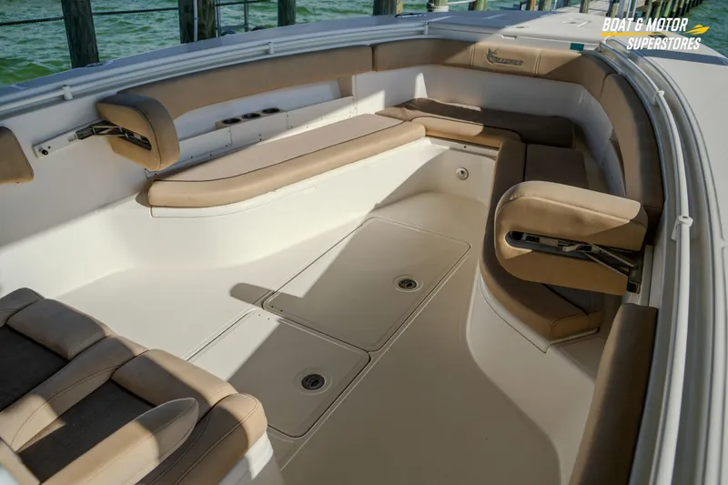  Yacht Photos Pics 2018 Key West Billistic 351 Center Console boat interior with beige seating and storage compartments.