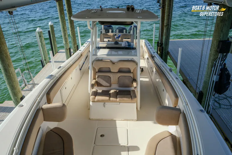  Yacht Photos Pics 2018 Key West Billistic 351 Center Console boat docked, showcasing spacious seating and sleek design.