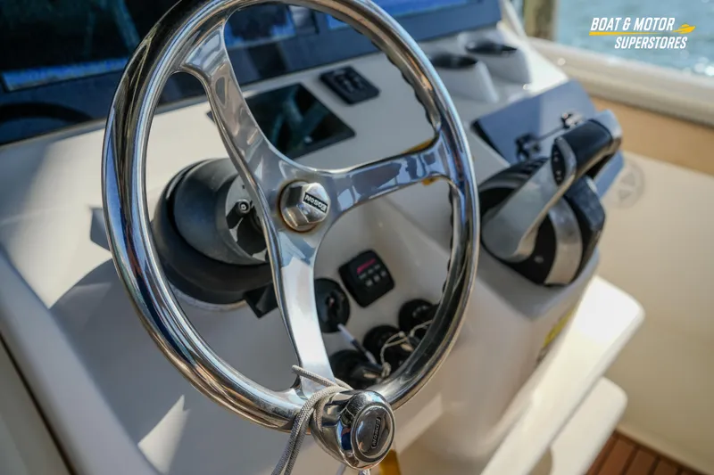  Yacht Photos Pics Steering wheel of 2018 Key West Billistic 351 Center Console boat, close-up view.