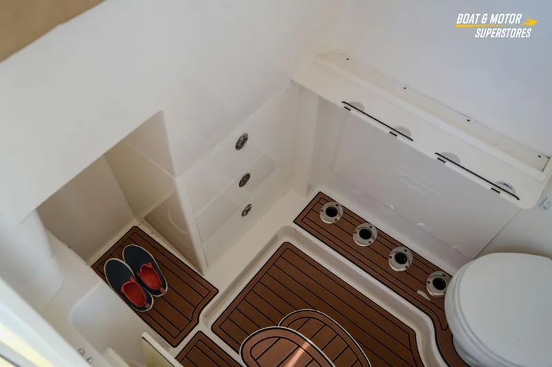  Yacht Photos Pics 2018 Key West Billistic 351 Center Console interior with storage and marine flooring.