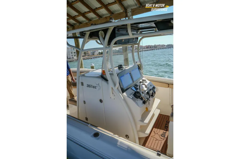  Yacht Photos Pics 2018 Key West Billistic 351 Center Console boat interior with steering wheel and navigation screens.