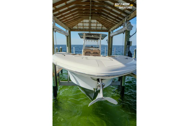  Yacht Photos Pics 2018 Key West Billistic 351 Center Console boat in dock, over green water.