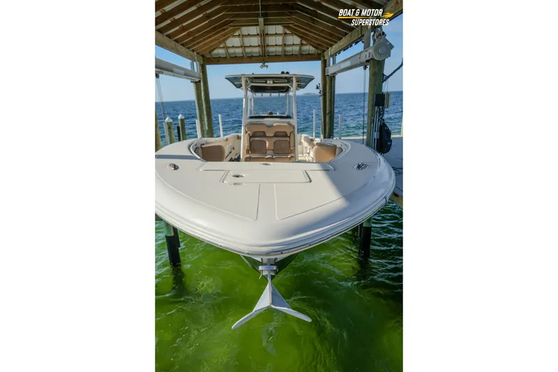  Yacht Photos Pics 2018 Key West Billistic 351 Center Console boat docked under a wooden shelter.