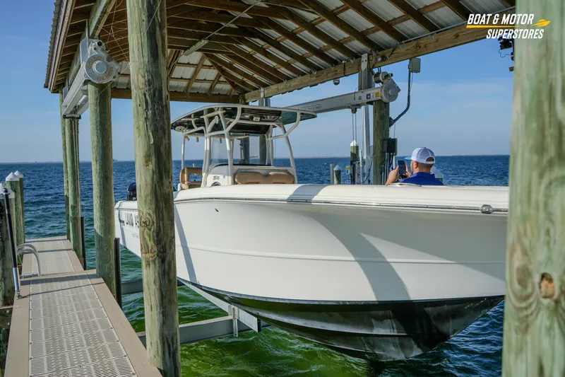  Yacht Photos Pics 2018 Key West Billistic 351 Center Console boat on lift by ocean dock.