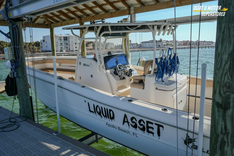  Yacht Photos Pics 2018 Key West Billistic 351 Center Console boat docked, labeled "Liquid Asset," in Apollo Beach, FL.