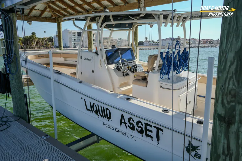  Yacht Photos Pics 2018 Key West Billistic 351 Center Console boat docked, featuring "Liquid Asset" name.
