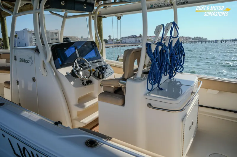  Yacht Photos Pics 2018 Key West Billistic 351 Center Console boat interior with steering wheel and ocean view.