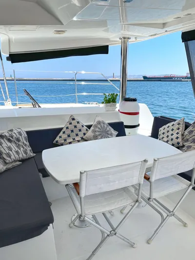Matilda Mia Yacht Photos Pics Luxurious Lagoon 52 catamaran deck with seating, table, and ocean view, 2015 model.