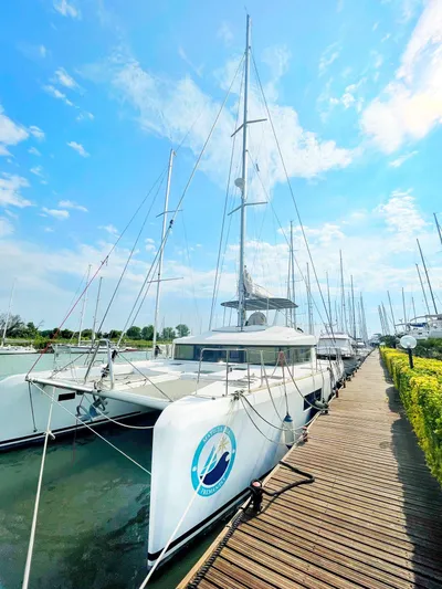 Matilda Mia Yacht Photos Pics 2015 Lagoon 52 catamaran docked under a clear blue sky.