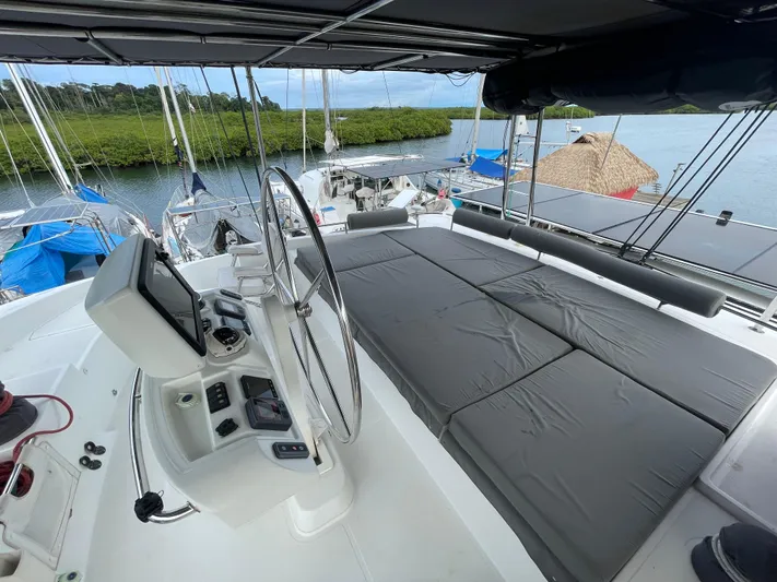 Matilda Mia Yacht Photos Pics 2015 Lagoon 52 yacht helm with spacious seating and scenic marina view.
